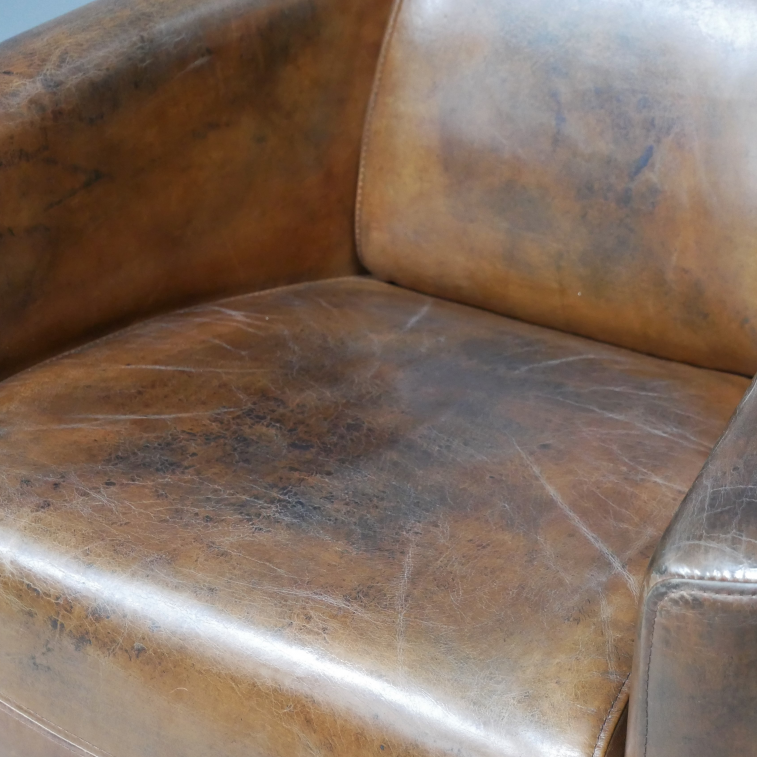 Brown Leather Cigar Chair close up seat