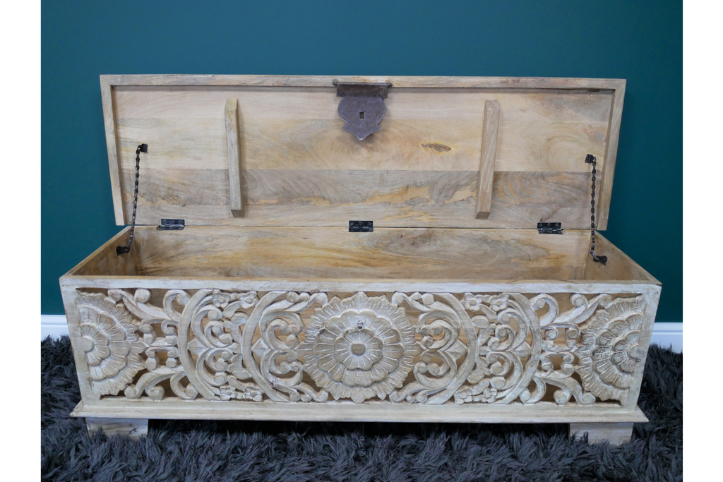 Ornate carved storage bench with metal chain as to keep it open