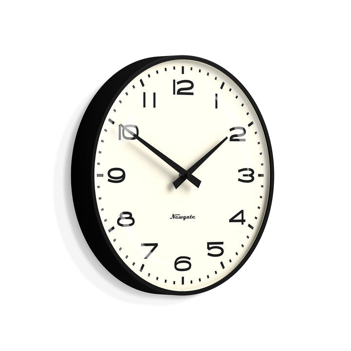 A retro-style wall clock with a matt black case and black arabic dial