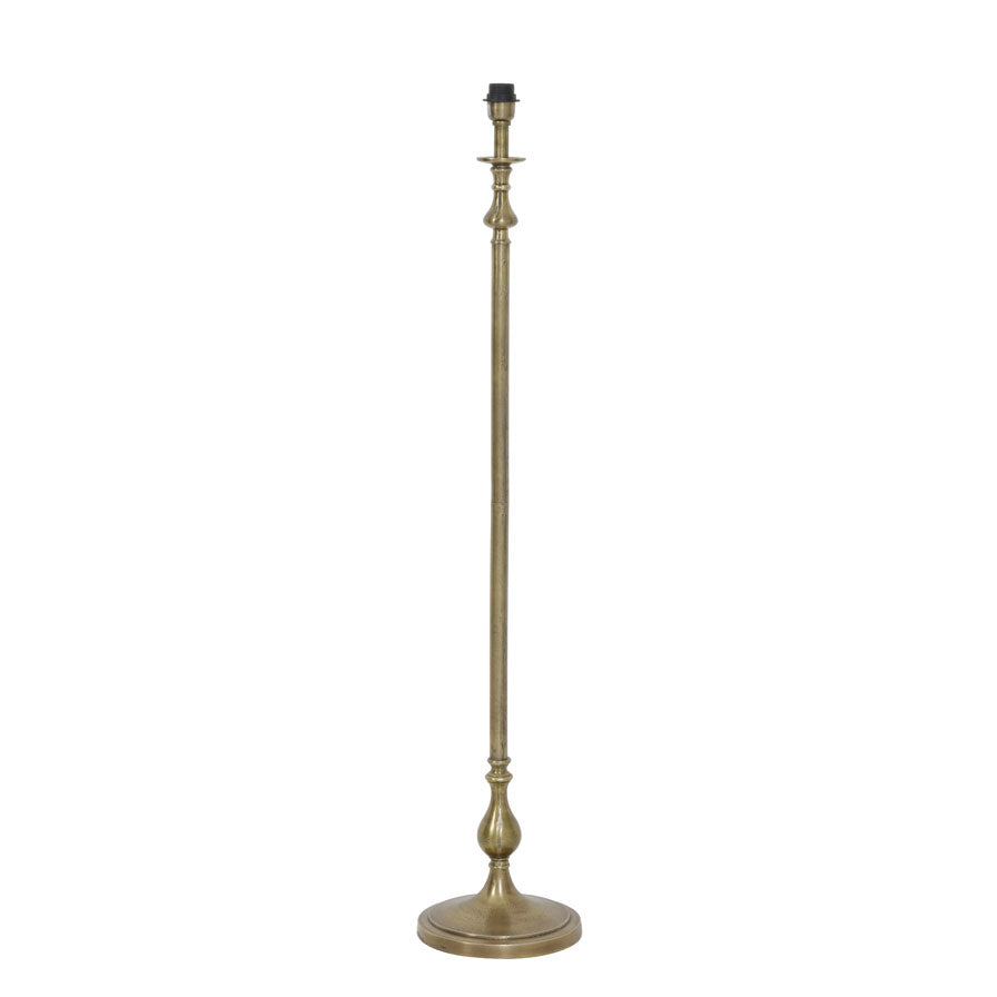 Raw antique bronze lamp Tall and slender floor lamp with curved details.