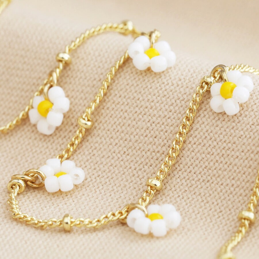 Beaded White Daisy Satellite Gold Chain Necklace close up white beaded daisy