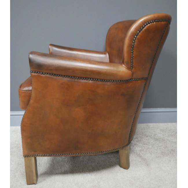 Brown Leather Cosy Chair side on view