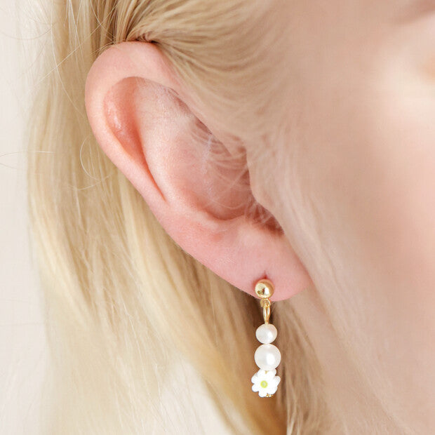 Daisy Flower Bead Gold Small Drop Earrings being worn