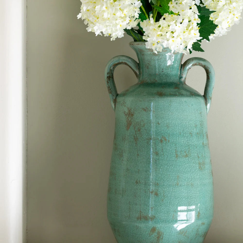 Decorative Tall Teal Vase With Handles filled with dried flowers