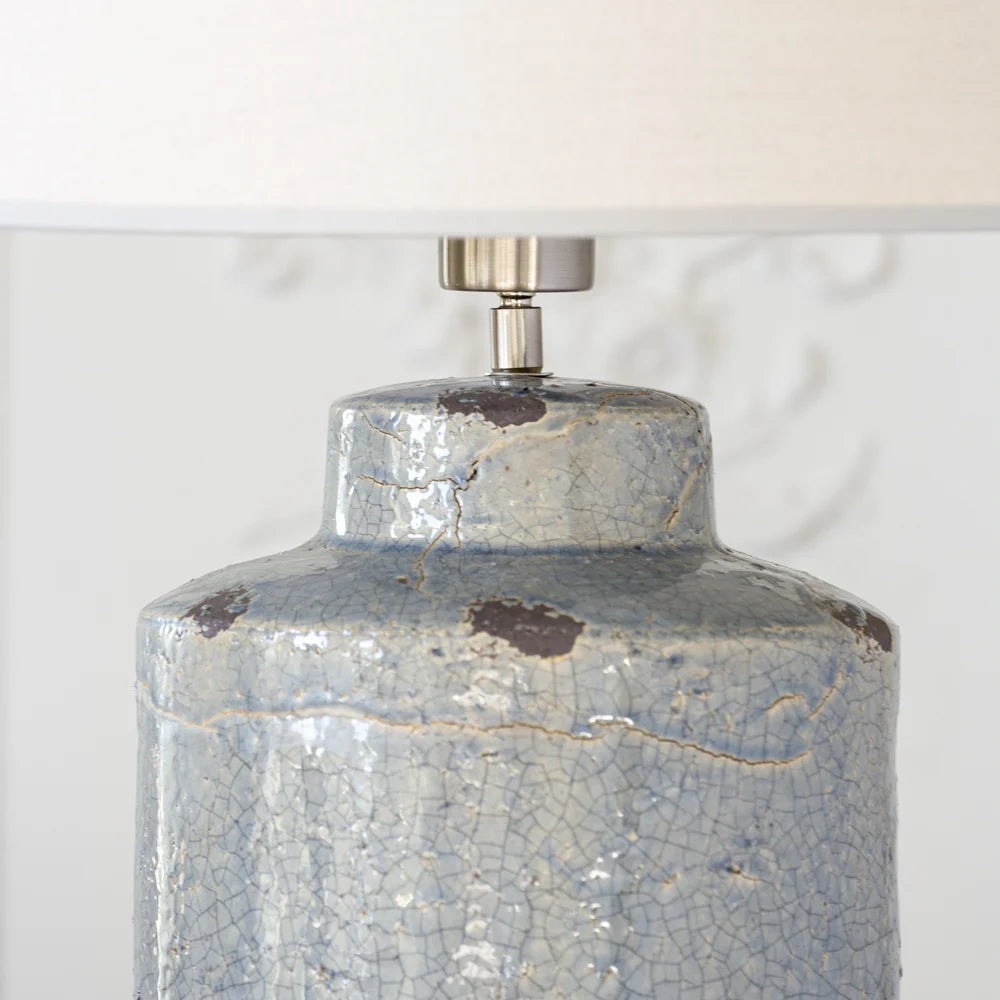 Distressed Blue Ceramic Table Lamp With Cream Linen Shade close up of lamp base