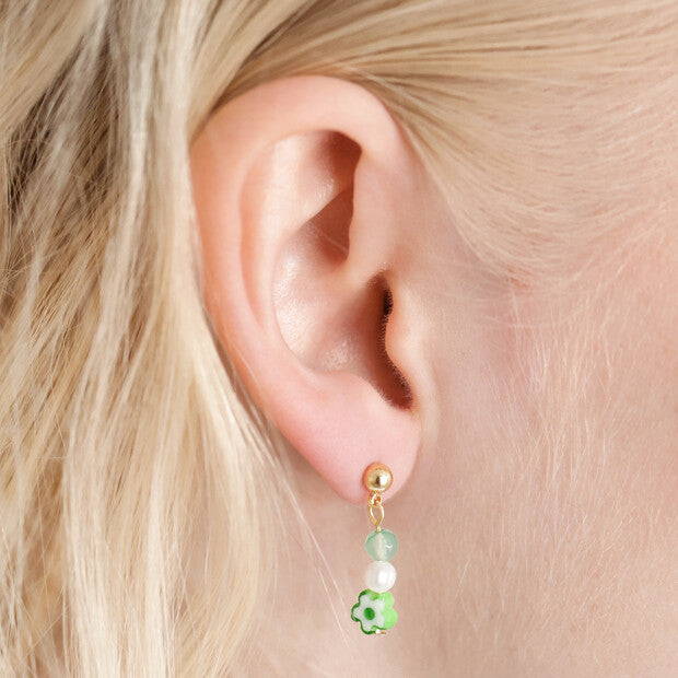 Green Flower Bead Gold Small Drop Earrings being worn featuring freshwater pearl bead