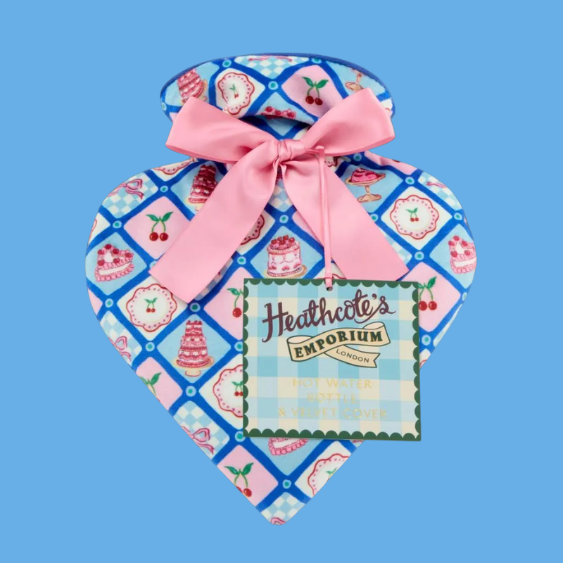 Hot Water Bottle & Velvet Cover in a heart shape with cakes and cherries etc decorating the cover