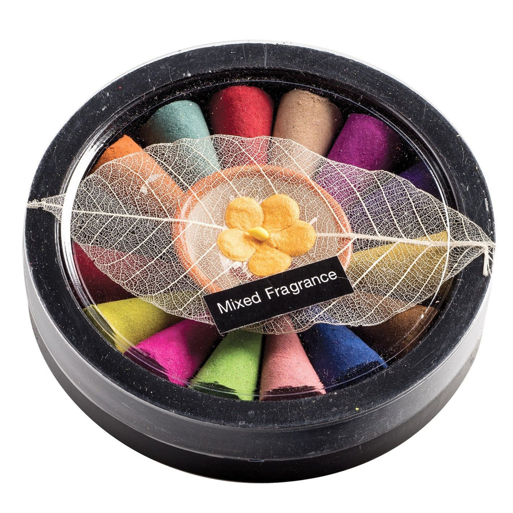 Mixed fragrance incense cones set with holder. The multi coloured incense cones are arranged in a black circular box with an incense dish in the middle