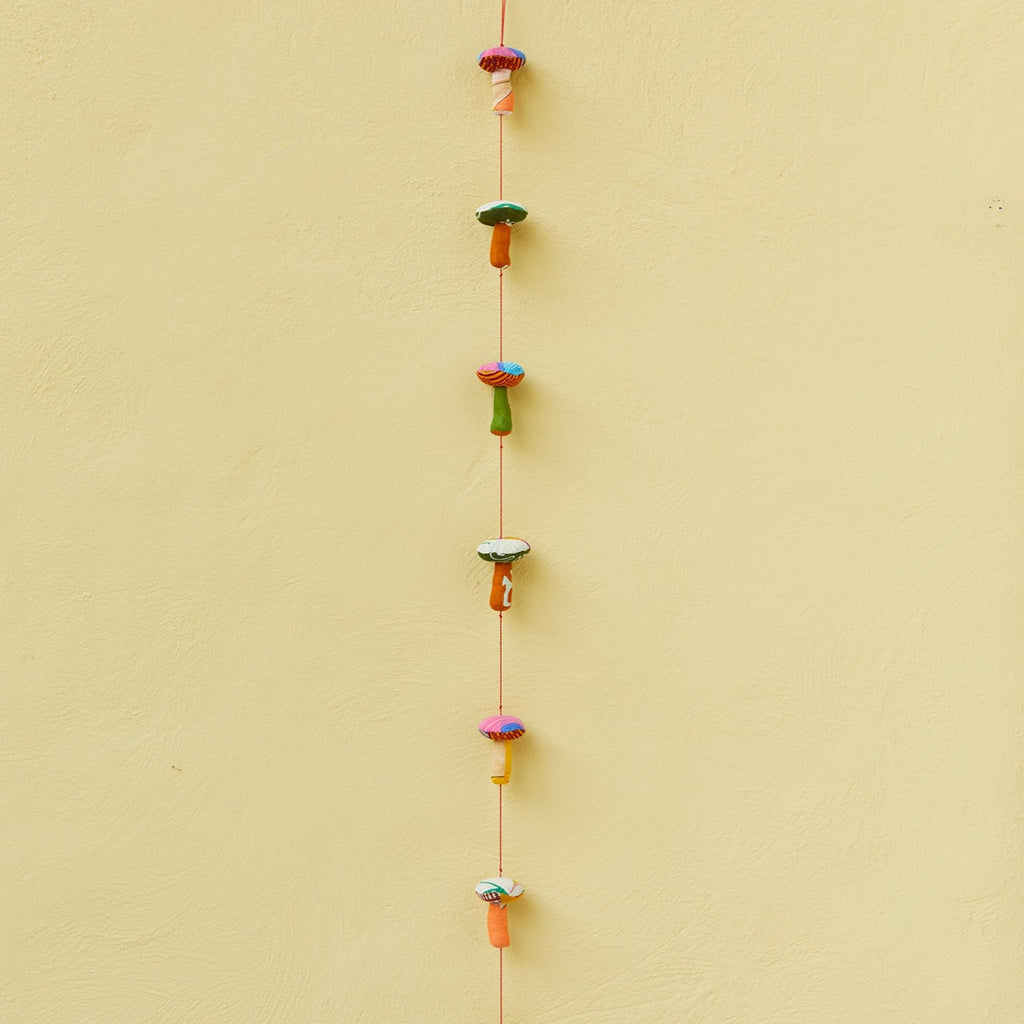 Recycled Sari Hanging Mushrooms Garland - suspended and hanging from a hook