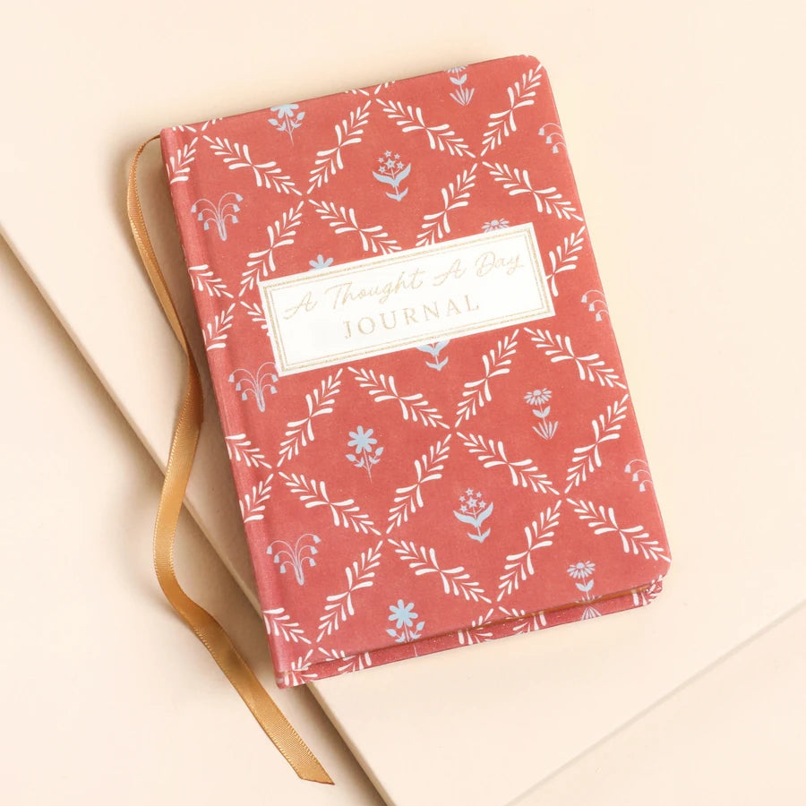 'Thoughts & Daydreams Journal' Terracotta journal with floral pattern and text on a beige background 79566 Uneeka