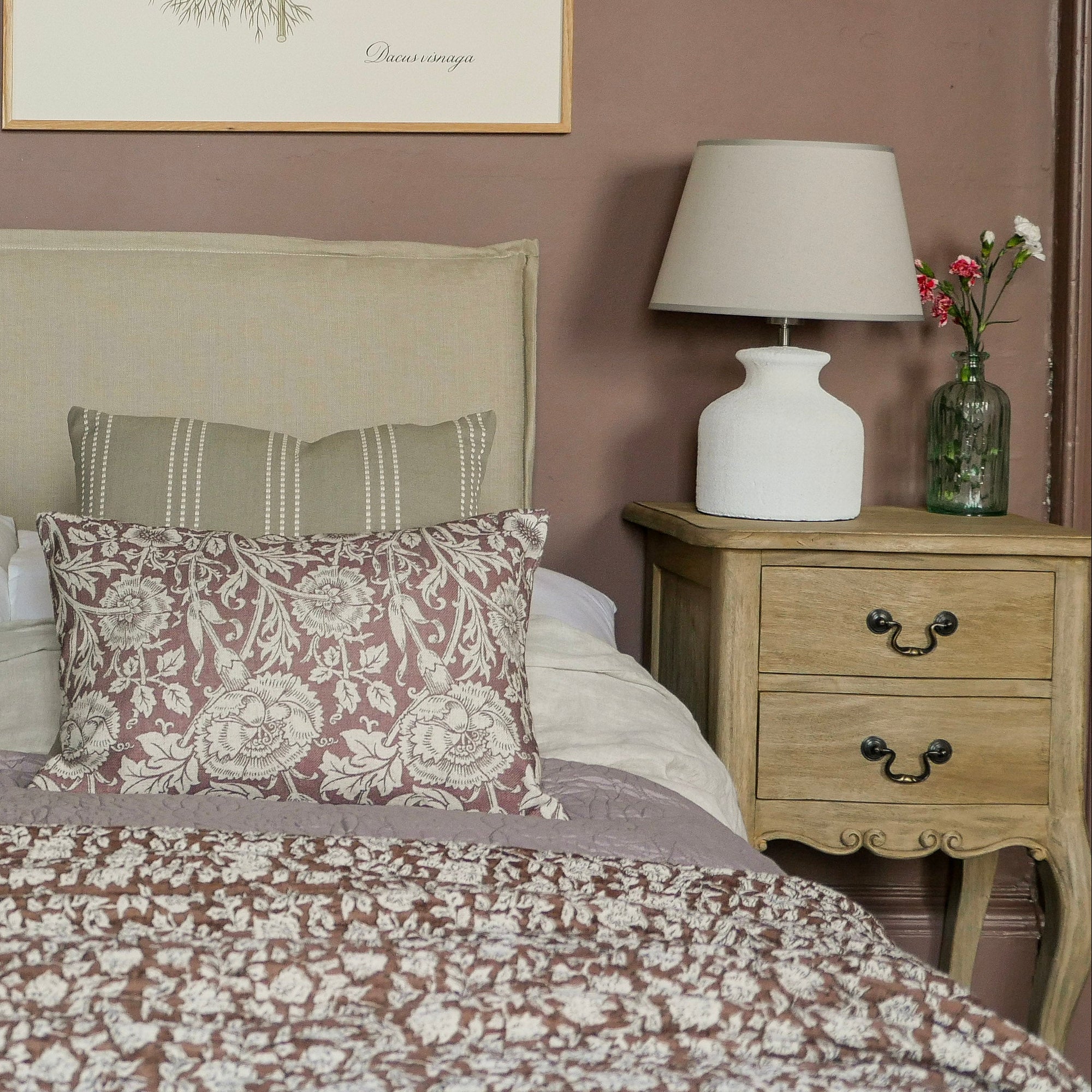 Bedroom with floral bedding, matching pillows, and two lamps on nightstands. Vintage 2 Drawer Side Table Uneeka Lifestyle