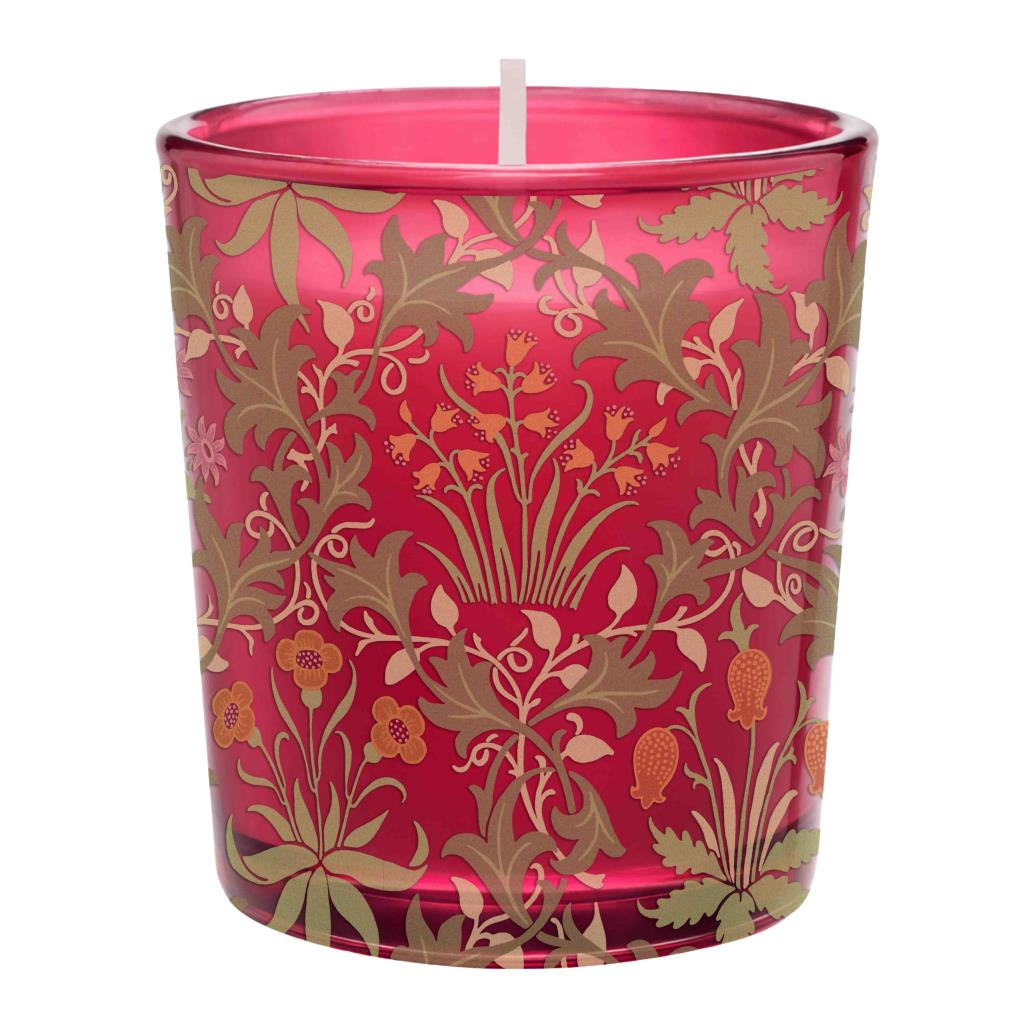 A red glass candle holder with a white wick, decorated with a metallic gold and orange botanical pattern, shown against a plain white background.