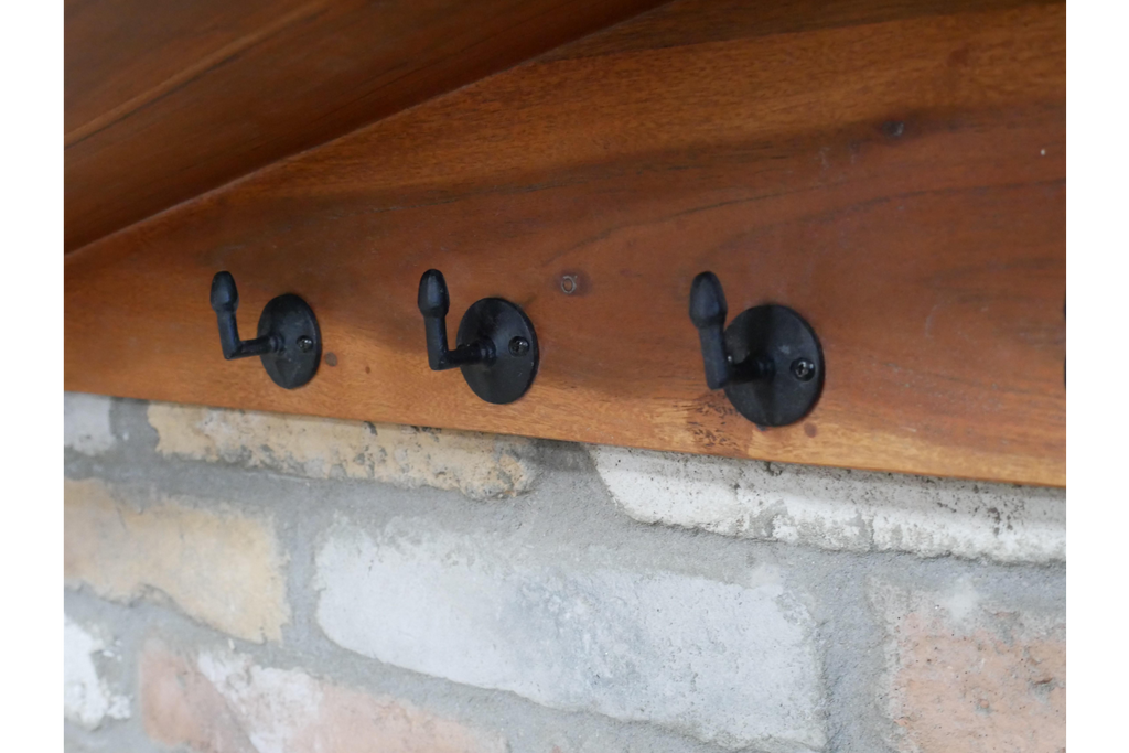 Wooden Coat Hook Rack & Slanted Shelf close up of black coat hooks