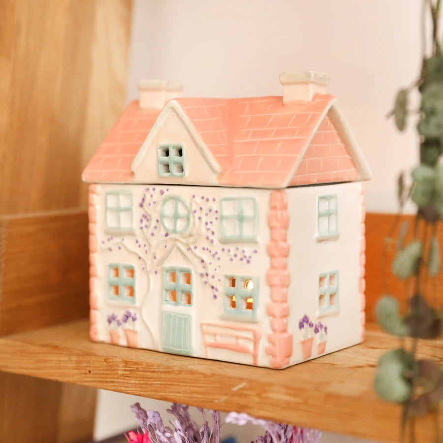 A ceramic house-shaped container or candle holder 83062 Uneeka