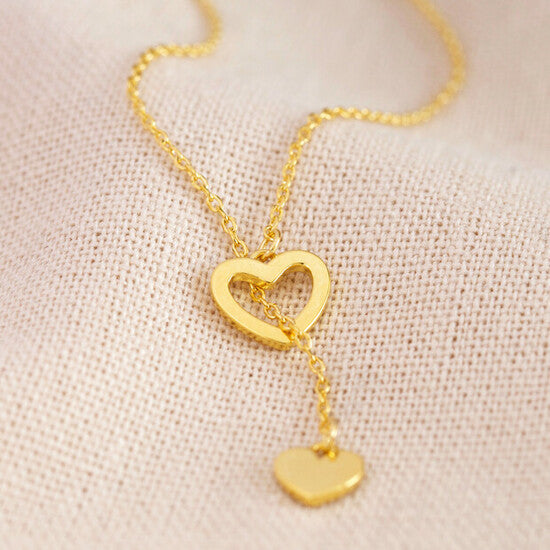 Mismatched Heart Pendant Lariat Necklace heart outline close up gold