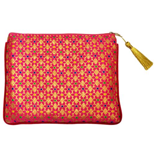 Pink floral piuch bag with gold pattern and gold fringe on the zipper