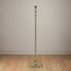 Raw antique bronze lamp Tall and slender floor lamp with curved details.
