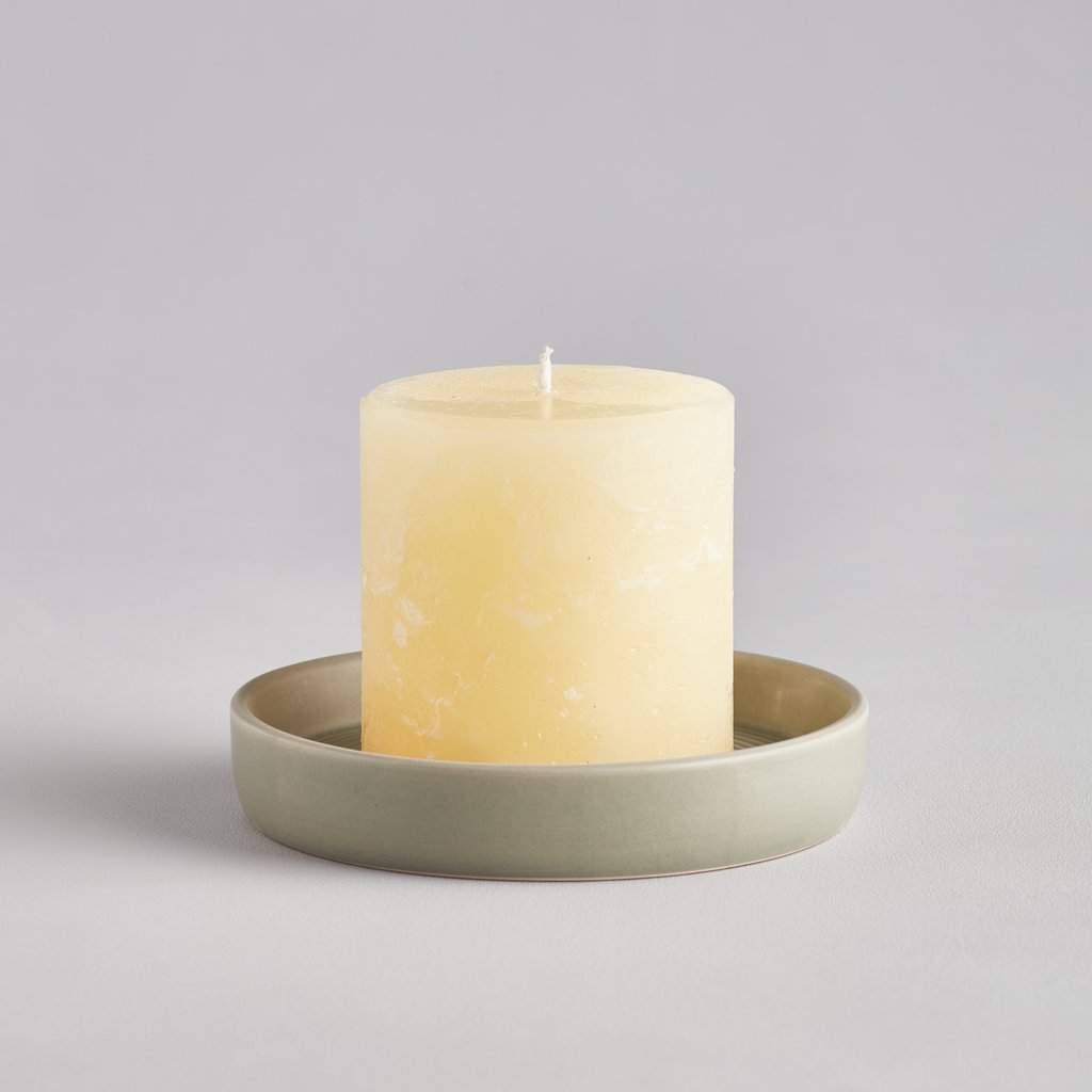 Small Light Grey-Green Ceramic Candle Plate featuring Large Pillar Candle as displey